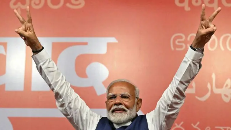 India’s Modi claims victory as he heads for reduced majority