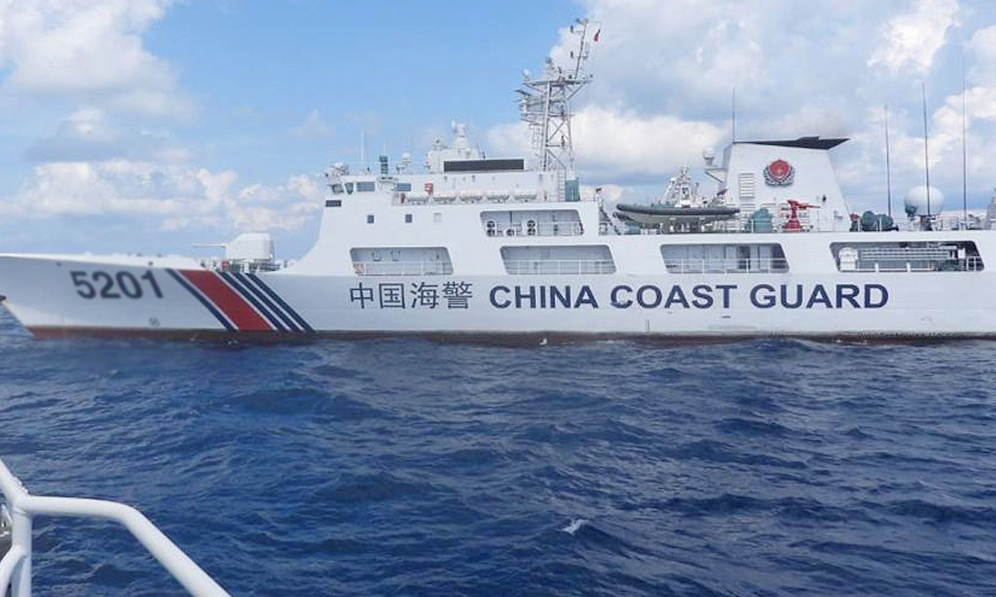 China holds National Day ceremony in waters off atoll claimed by Philippines